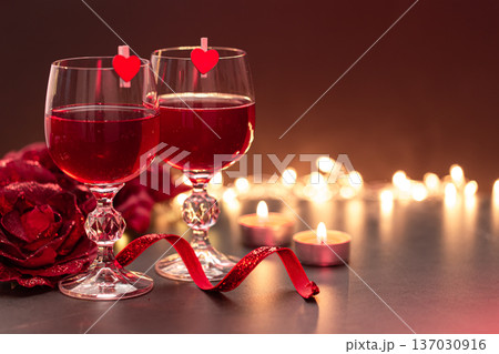 Background for Valentine's Day with glasses of wine on a blurred background. Background for Valentine's Day with glasses of wine on a blurred background. 137030916