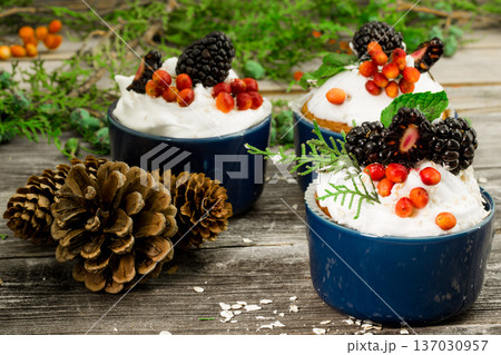 beautiful Christmas cupcake with cream and berry beautiful Christmas cupcake with cream and berry 137030957