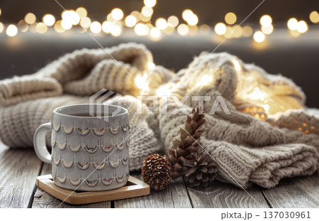 Beautiful christmas cup and candles on blurred background with bokeh. 137030961