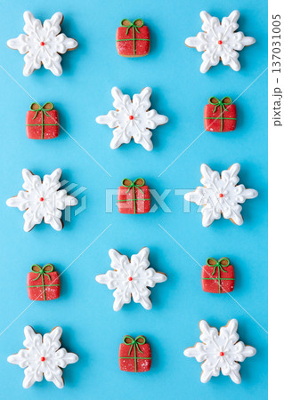 Beautiful handmade Christmas glazed gingerbread cookies on a blue background. 137031005