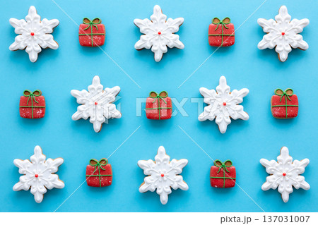 Beautiful handmade Christmas glazed gingerbread cookies on a blue background. 137031007