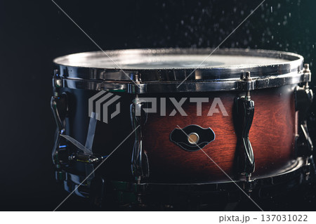 Beautiful snare drum on a black background, close up. Beautiful snare drum on a black background, close up. 137031022