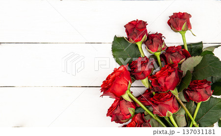 Bouquet of red roses on a white background, flat lay, copy space. Bouquet of red roses on a white background, flat lay, copy space. 137031181