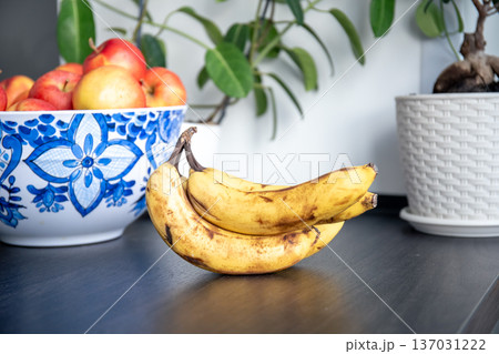 Bunch of bananas on kitchen table, close up. 137031222