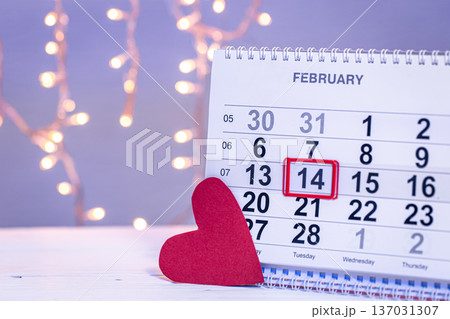 Calendar with the date February 14, a festive background for Valentine's Day. Calendar with the date February 14, a festive background for Valentine's Day. 137031307