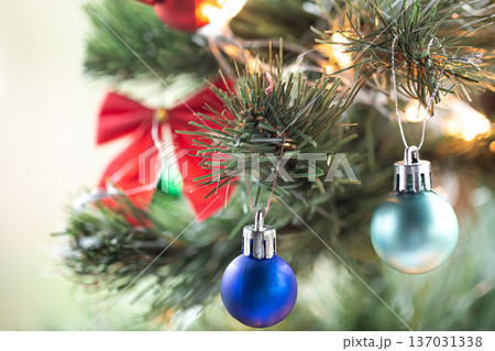 Christmas background with Christmas balls on a Christmas tree. Christmas background with Christmas balls on a Christmas tree. 137031338