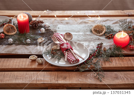 Table setting for a festive Christmas dinner. Table setting for a festive Christmas dinner. 137031345
