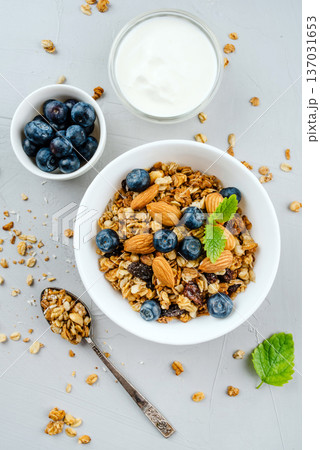 Baked granola with yogurt and blueberries. Baked granola with yogurt and blueberries. 137031653