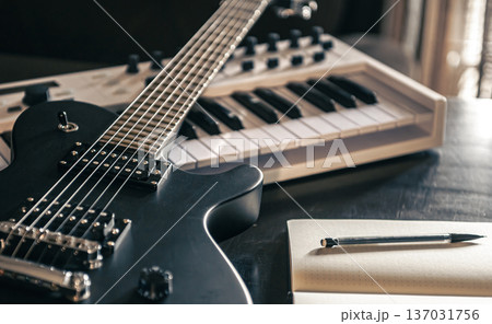 Close up, electric guitar and piano, musical creativity concept. Close up, electric guitar and piano, musical creativity concept. 137031756