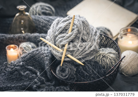 Close-up, gray threads for knitting, yarn with wooden knitting needles. 137031779