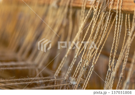 A close up image of an old weaving loom, details. 137031808