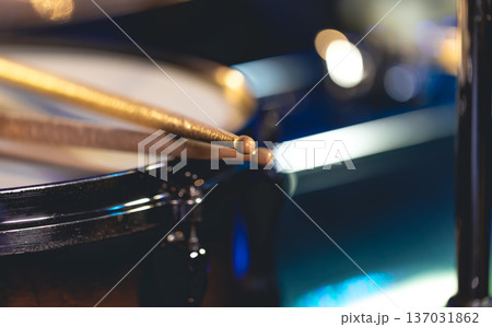 Close-up, snare drum and drumsticks on a dark background. Close-up, snare drum and drumsticks on a dark background. 137031862
