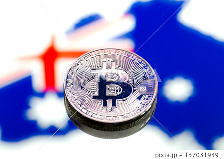 coins Bitcoin, against the background of Australia and the Australian flag, concept of virtual money, close-up. Conceptual image. 137031939