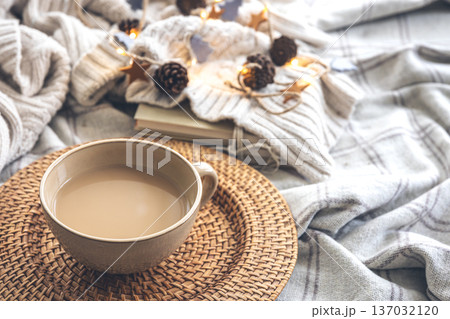 Cozy autumn composition with a big cup of coffee in bed. 137032120