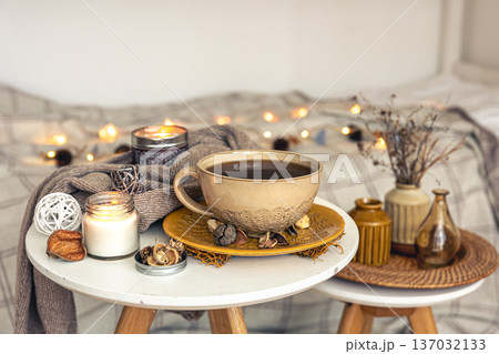 Cozy autumn composition with a cup of tea and decorative details. 137032133