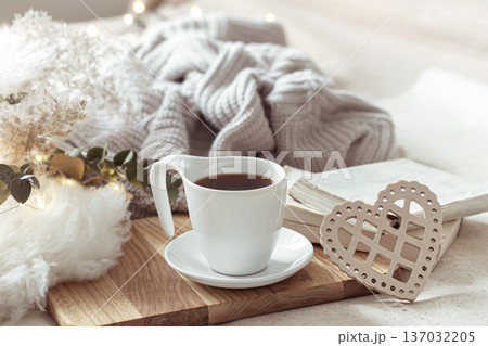 White cup with drink on blurred background home decor. 137032205