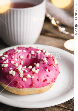 Cozy composition with donut and cup of tea. 137032225