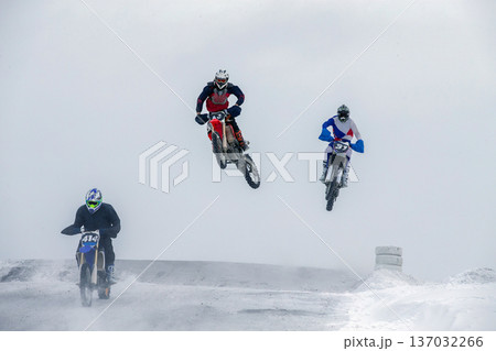 Three motocross riders 137032266