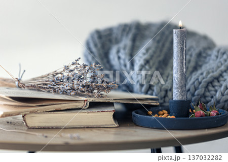 Cozy home composition with books on the table close-up. Cozy home composition with books on the table close-up. 137032282
