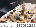 Cozy home composition with a cup of coffee, a candle and decorative details. 137032288