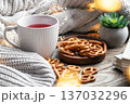 Cozy home composition with a cup of tea and pretzels. 137032296