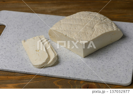 Fresh Sulguni Cheese on Rustic Kitchen Table 137032977