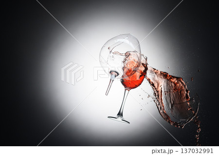 Broken Wine Glasses with Red Wine Splashes and Glass Shards 137032991