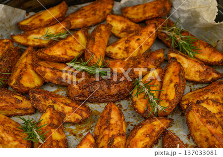 Rustic Oven-Roasted Potato Wedges with Rosemary and Thyme 137033081