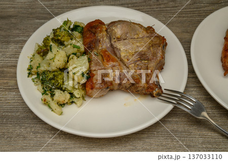 Bone-In Pork Chop Cauliflower Herb Combination Plate Bone-In Pork Chop Cauliflower Herb Combination Plate 137033110