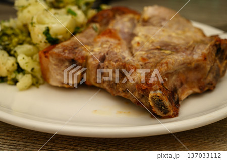 Bone-In Pork Chop with Potato or Cauliflower Herb Side Bone-In Pork Chop with Potato or Cauliflower Herb Side 137033112