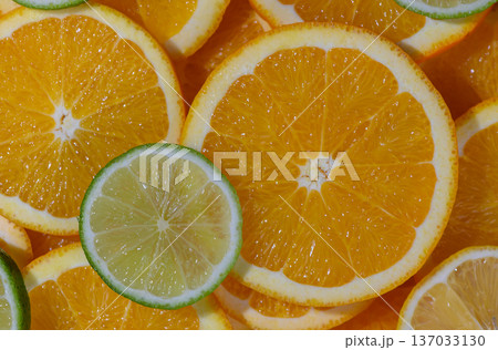 Fresh Orange and Lime Round Slices Background Fresh Orange and Lime Round Slices Background 137033130