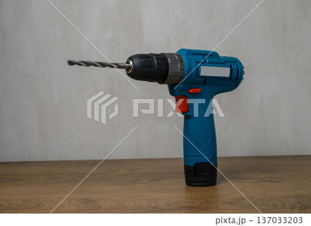 Professional Cordless Drill with Metal Bit Isolated White Background 137033203