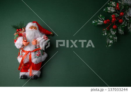 Santa Claus Figurine with Holly Branch Christmas Composition Santa Claus Figurine with Holly Branch Christmas Composition 137033244