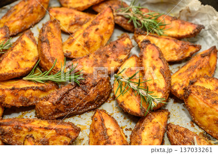 Rustic Potato Wedges with Fresh Rosemary and Sea Salt Rustic Potato Wedges with Fresh Rosemary and Sea Salt 137033261