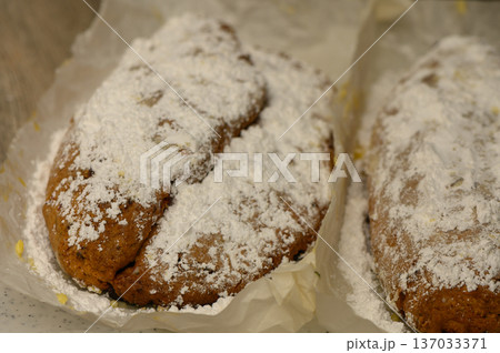 German Christmas Stollen with Curd Cheese on Kitchen Table Traditional Holiday Bread German Christmas Stollen with Curd Cheese on Kitchen Table Traditional Holiday Bread 137033371