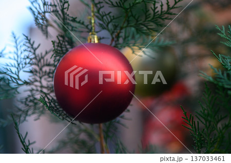 Red Christmas Ornaments on Snowy Pine Branch with Bokeh Lights Red Christmas Ornaments on Snowy Pine Branch with Bokeh Lights 137033461