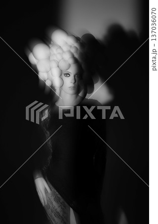 Woman with ethereal spheres forming abstract headwear Woman with ethereal spheres forming abstract headwear 137036070