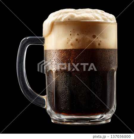 Foamy dark stout beer in a mug glass with creamy foam head, isolated on black background, concept of refreshment and taste 137036800