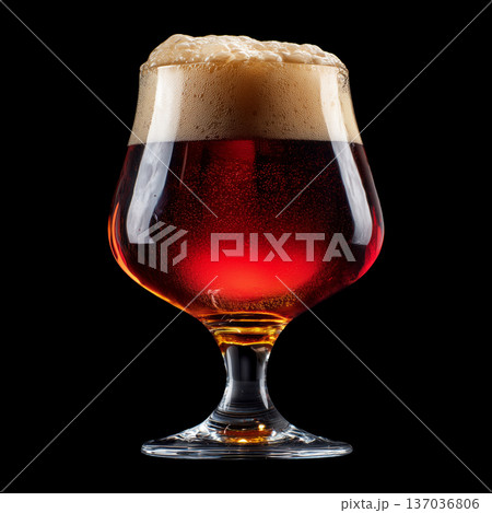 Foamy red ale beer in a tall tulip glass with creamy foam head, isolated on black background, concept of refreshment and taste Foamy red ale beer in a tall tulip glass with creamy foam head, isolated on black background, concept of refreshment and taste 137036806