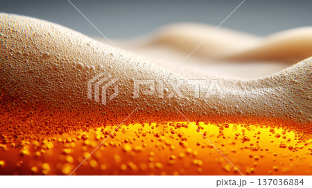 Closeup view of curved beer foam and golden bubbles on warm blurred background, expressing freshness concept Closeup view of curved beer foam and golden bubbles on warm blurred background, expressing freshness concept 137036884