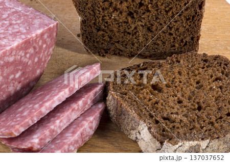 Close-up of bread and sausage on a table Close-up of bread and sausage on a table 137037652