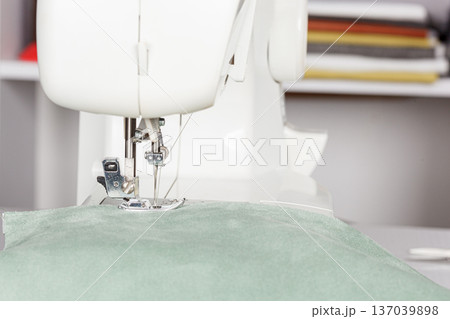Sewing machine, stitching fabrics, needle in a round plan Sewing machine, stitching fabrics, needle in a round plan 137039898