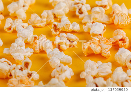 box with popcorn on a yellow background box with popcorn on a yellow background 137039930