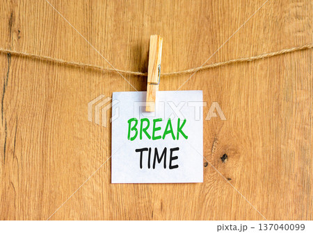 Break time symbol. Concept word Break time on beautiful white paper. Beautiful wooden clothespin. Beautiful wooden background. Business break time concept. Copy space. Break time symbol. Concept word Break time on beautiful white paper. Beautiful wooden clothespin. Beautiful wooden background. Business break time concept. Copy space. 137040099