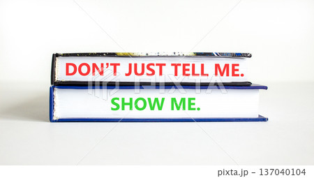 Tell or show symbol. Concept words Do not just tell me, show me on beautiful books. Beautiful white paper background. Business tell or show concept. Copy space. 137040104