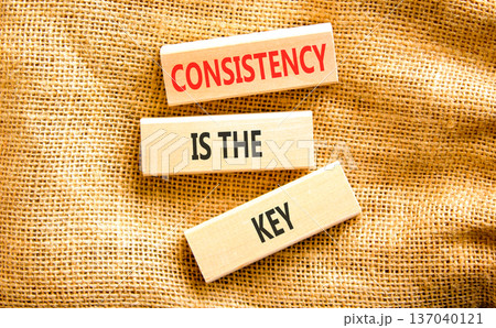 Consistency is the key symbol. Concept words Consistency is the key on beautiful wooden blocks. Beautiful canvas background. Business consistency is the key concept. Copy space. 137040121