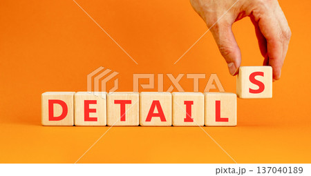 Details detail symbol. Concept word Details on beautiful wooden blocks. Beautiful orange background. Businessman's hand. Business details concept. Copy space. 137040189