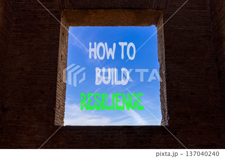 How to build resilience symbol. Concept words How to build resilience on beautiful window in ancient brick wall. Beautiful blue sky background. Business how to build resilience concept. Copy space. 137040240