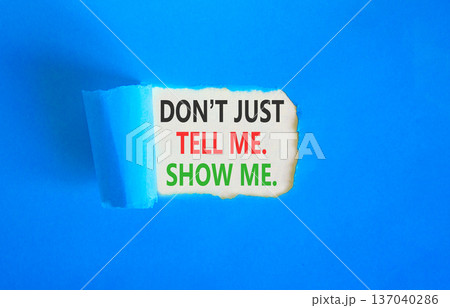 Tell or show symbol. Concept words Do not just tell me, show me on beautiful white paper. Beautiful blue paper background. Business tell or show concept. Copy space. Tell or show symbol. Concept words Do not just tell me, show me on beautiful white paper. Beautiful blue paper background. Business tell or show concept. Copy space. 137040286