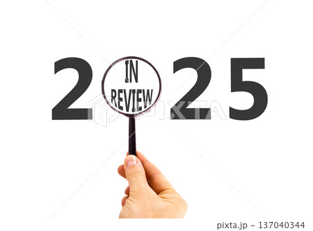 2025 in review new year symbol. Concept words 2025 in review in beautiful magnifying glass. Beautiful white background. Businessman's hand. Business 2025 in review new year concept. Copy space. 2025 in review new year symbol. Concept words 2025 in review in beautiful magnifying glass. Beautiful white background. Businessman's hand. Business 2025 in review new year concept. Copy space. 137040344